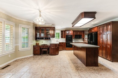 Welcome to this stately brick home overlooking the 11th hole of on Sea Trail Golf Resort in North Carolina - for sale on GolfHomes.com, golf home, golf lot