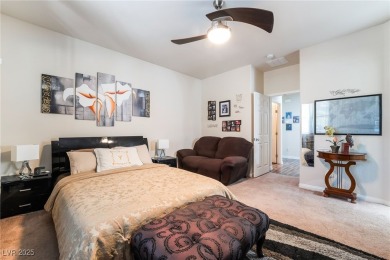 Paid-off solar panels and a prime corner lot with an expansive on Rhodes Ranch Golf Club in Nevada - for sale on GolfHomes.com, golf home, golf lot
