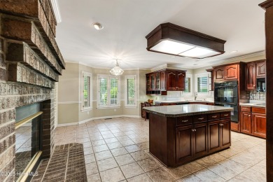 Welcome to this stately brick home overlooking the 11th hole of on Sea Trail Golf Resort in North Carolina - for sale on GolfHomes.com, golf home, golf lot