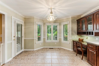 Welcome to this stately brick home overlooking the 11th hole of on Sea Trail Golf Resort in North Carolina - for sale on GolfHomes.com, golf home, golf lot