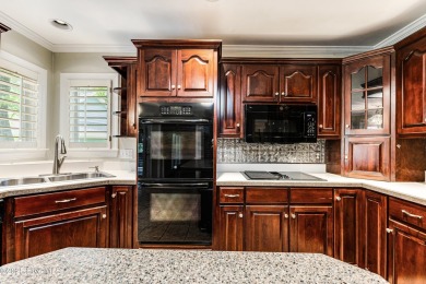 Welcome to this stately brick home overlooking the 11th hole of on Sea Trail Golf Resort in North Carolina - for sale on GolfHomes.com, golf home, golf lot