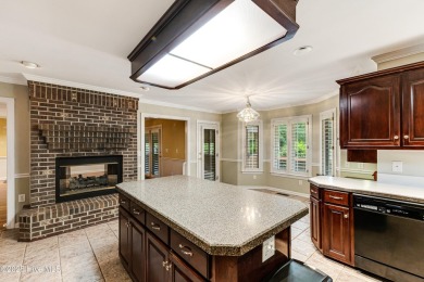 Welcome to this stately brick home overlooking the 11th hole of on Sea Trail Golf Resort in North Carolina - for sale on GolfHomes.com, golf home, golf lot