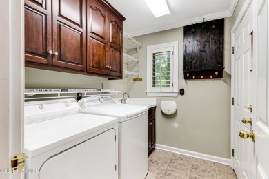 Welcome to this stately brick home overlooking the 11th hole of on Sea Trail Golf Resort in North Carolina - for sale on GolfHomes.com, golf home, golf lot