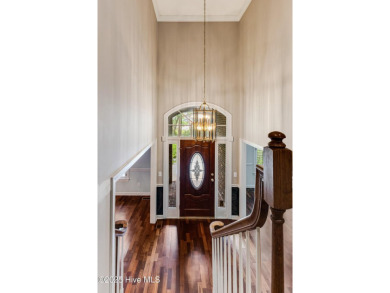 Welcome to this stately brick home overlooking the 11th hole of on Sea Trail Golf Resort in North Carolina - for sale on GolfHomes.com, golf home, golf lot