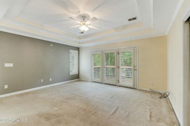 Welcome to this stately brick home overlooking the 11th hole of on Sea Trail Golf Resort in North Carolina - for sale on GolfHomes.com, golf home, golf lot