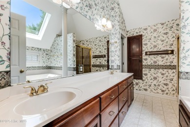 Welcome to this stately brick home overlooking the 11th hole of on Sea Trail Golf Resort in North Carolina - for sale on GolfHomes.com, golf home, golf lot