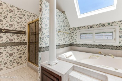 Welcome to this stately brick home overlooking the 11th hole of on Sea Trail Golf Resort in North Carolina - for sale on GolfHomes.com, golf home, golf lot
