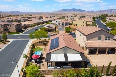Paid-off solar panels and a prime corner lot with an expansive on Rhodes Ranch Golf Club in Nevada - for sale on GolfHomes.com, golf home, golf lot