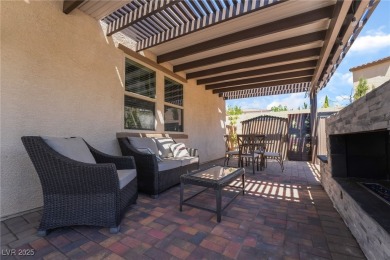 Paid-off solar panels and a prime corner lot with an expansive on Rhodes Ranch Golf Club in Nevada - for sale on GolfHomes.com, golf home, golf lot
