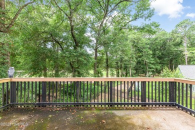 Welcome to this stately brick home overlooking the 11th hole of on Sea Trail Golf Resort in North Carolina - for sale on GolfHomes.com, golf home, golf lot
