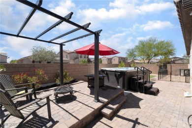 Paid-off solar panels and a prime corner lot with an expansive on Rhodes Ranch Golf Club in Nevada - for sale on GolfHomes.com, golf home, golf lot