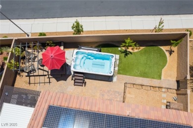Paid-off solar panels and a prime corner lot with an expansive on Rhodes Ranch Golf Club in Nevada - for sale on GolfHomes.com, golf home, golf lot