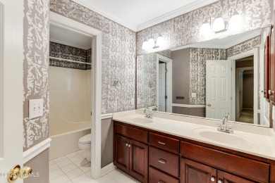 Welcome to this stately brick home overlooking the 11th hole of on Sea Trail Golf Resort in North Carolina - for sale on GolfHomes.com, golf home, golf lot