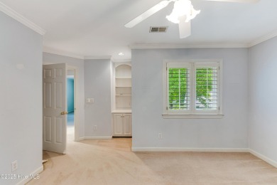 Welcome to this stately brick home overlooking the 11th hole of on Sea Trail Golf Resort in North Carolina - for sale on GolfHomes.com, golf home, golf lot