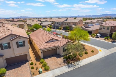 Paid-off solar panels and a prime corner lot with an expansive on Rhodes Ranch Golf Club in Nevada - for sale on GolfHomes.com, golf home, golf lot