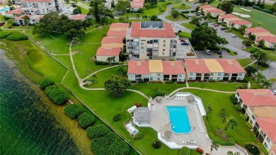 You won't want to miss this first floor 2 bedroom, 2 bath villa on Isla Del Sol Yacht and Country Club in Florida - for sale on GolfHomes.com, golf home, golf lot