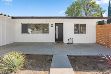 This stunning 3-bedroom, 2-bathroom home in West Banning offers on Sun Lakes Country Club in California - for sale on GolfHomes.com, golf home, golf lot