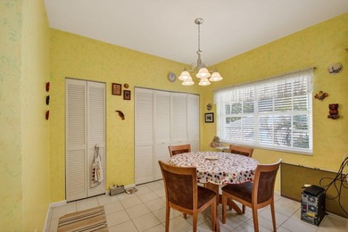 Lovely 2 bedroom, 2 bath residence with soaring vaulted ceilings on Indian Spring Golf and Country Club in Florida - for sale on GolfHomes.com, golf home, golf lot