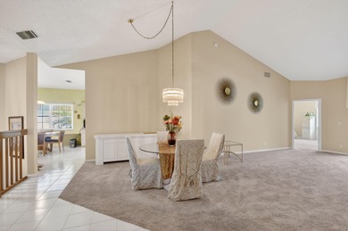Lovely 2 bedroom, 2 bath residence with soaring vaulted ceilings on Indian Spring Golf and Country Club in Florida - for sale on GolfHomes.com, golf home, golf lot
