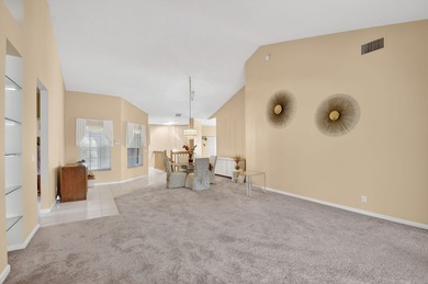 Lovely 2 bedroom, 2 bath residence with soaring vaulted ceilings on Indian Spring Golf and Country Club in Florida - for sale on GolfHomes.com, golf home, golf lot