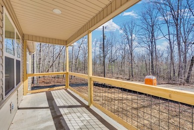 Experience modern comfort and a true lakeside lifestyle in this on Lake Tansi Village Country Club in Tennessee - for sale on GolfHomes.com, golf home, golf lot