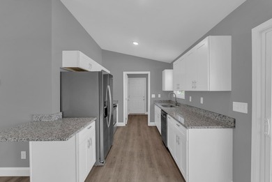 Experience modern comfort and a true lakeside lifestyle in this on Lake Tansi Village Country Club in Tennessee - for sale on GolfHomes.com, golf home, golf lot