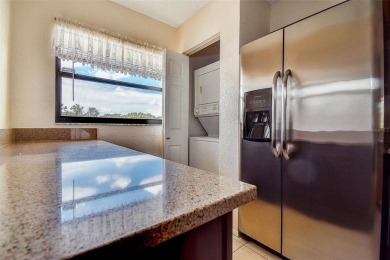 Step into a bright, easy-living 2-bedroom, 2-bath condominium on Cove Cay Country Club in Florida - for sale on GolfHomes.com, golf home, golf lot