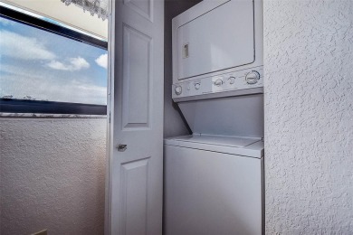Step into a bright, easy-living 2-bedroom, 2-bath condominium on Cove Cay Country Club in Florida - for sale on GolfHomes.com, golf home, golf lot