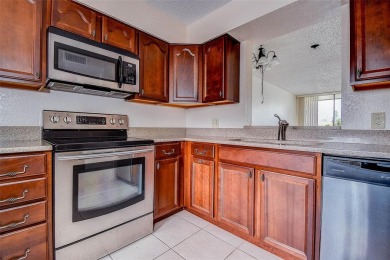 Step into a bright, easy-living 2-bedroom, 2-bath condominium on Cove Cay Country Club in Florida - for sale on GolfHomes.com, golf home, golf lot