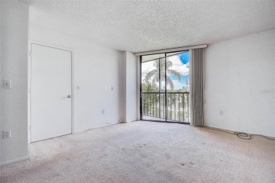 Step into a bright, easy-living 2-bedroom, 2-bath condominium on Cove Cay Country Club in Florida - for sale on GolfHomes.com, golf home, golf lot