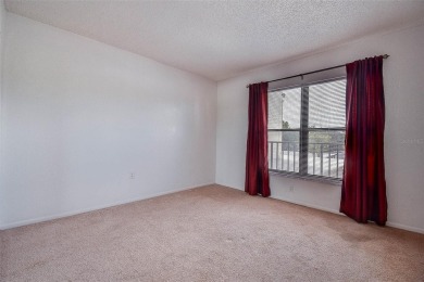Step into a bright, easy-living 2-bedroom, 2-bath condominium on Cove Cay Country Club in Florida - for sale on GolfHomes.com, golf home, golf lot