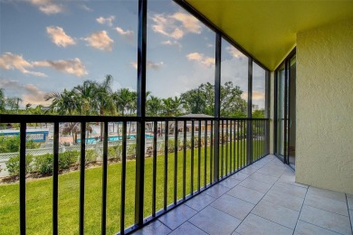 Step into a bright, easy-living 2-bedroom, 2-bath condominium on Cove Cay Country Club in Florida - for sale on GolfHomes.com, golf home, golf lot