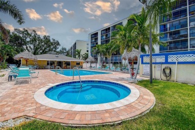 Step into a bright, easy-living 2-bedroom, 2-bath condominium on Cove Cay Country Club in Florida - for sale on GolfHomes.com, golf home, golf lot