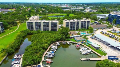 Step into a bright, easy-living 2-bedroom, 2-bath condominium on Cove Cay Country Club in Florida - for sale on GolfHomes.com, golf home, golf lot