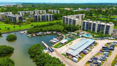 Step into a bright, easy-living 2-bedroom, 2-bath condominium on Cove Cay Country Club in Florida - for sale on GolfHomes.com, golf home, golf lot