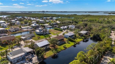 Discover this delightful Olde Florida-style, two-story home on The Colony Golf and Country Club in Florida - for sale on GolfHomes.com, golf home, golf lot