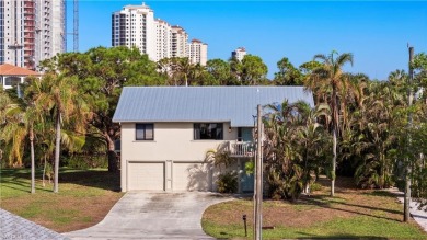 Discover this delightful Olde Florida-style, two-story home on The Colony Golf and Country Club in Florida - for sale on GolfHomes.com, golf home, golf lot