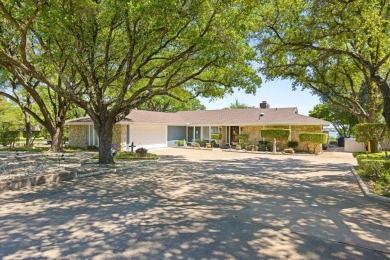 Welcome to your dream lakefront retreat! Situated on nearly half on De Cordova Bend Country Club in Texas - for sale on GolfHomes.com, golf home, golf lot