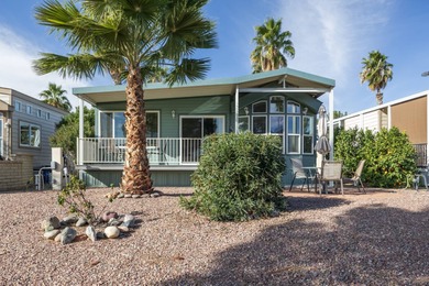 Wake up to breathtaking golf course views on Hole 14, where lush on Palm Creek Golf and RV Resort in Arizona - for sale on GolfHomes.com, golf home, golf lot