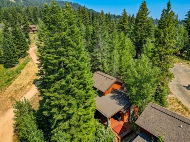 Discover luxury & convenience in this ski-in/ski-out cottage on Osprey Meadows at Tamarack Resort in Idaho - for sale on GolfHomes.com, golf home, golf lot