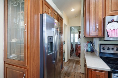 Wake up to breathtaking golf course views on Hole 14, where lush on Palm Creek Golf and RV Resort in Arizona - for sale on GolfHomes.com, golf home, golf lot