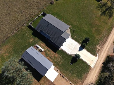 Built in 2021, this three-bedroom, two-bathroom back-lot lake on Roy View Golf Course in South Dakota - for sale on GolfHomes.com, golf home, golf lot