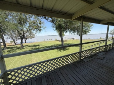 Enjoy Lake Views From This Coveted Waterfront Property on The Club At Runaway Bay in Texas - for sale on GolfHomes.com, golf home, golf lot