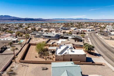 Welcome to this spacious Santa Fe Style 3-bedroom home in Lake on London Bridge Golf Course in Arizona - for sale on GolfHomes.com, golf home, golf lot