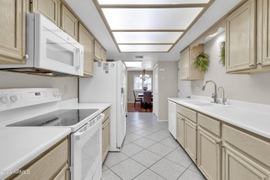 This charming townhome, nestled within a vibrant 55+ active on Sunland Village East Golf Course in Arizona - for sale on GolfHomes.com, golf home, golf lot