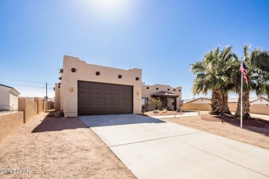 Welcome to this spacious Santa Fe Style 3-bedroom home in Lake on London Bridge Golf Course in Arizona - for sale on GolfHomes.com, golf home, golf lot