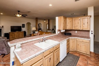 Welcome to this spacious Santa Fe Style 3-bedroom home in Lake on London Bridge Golf Course in Arizona - for sale on GolfHomes.com, golf home, golf lot