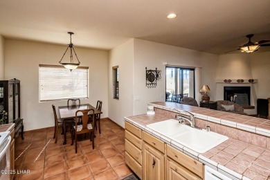 Welcome to this spacious Santa Fe Style 3-bedroom home in Lake on London Bridge Golf Course in Arizona - for sale on GolfHomes.com, golf home, golf lot