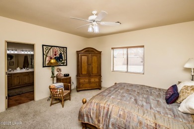 Welcome to this spacious Santa Fe Style 3-bedroom home in Lake on London Bridge Golf Course in Arizona - for sale on GolfHomes.com, golf home, golf lot