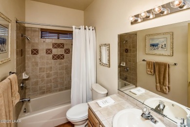 Welcome to this spacious Santa Fe Style 3-bedroom home in Lake on London Bridge Golf Course in Arizona - for sale on GolfHomes.com, golf home, golf lot